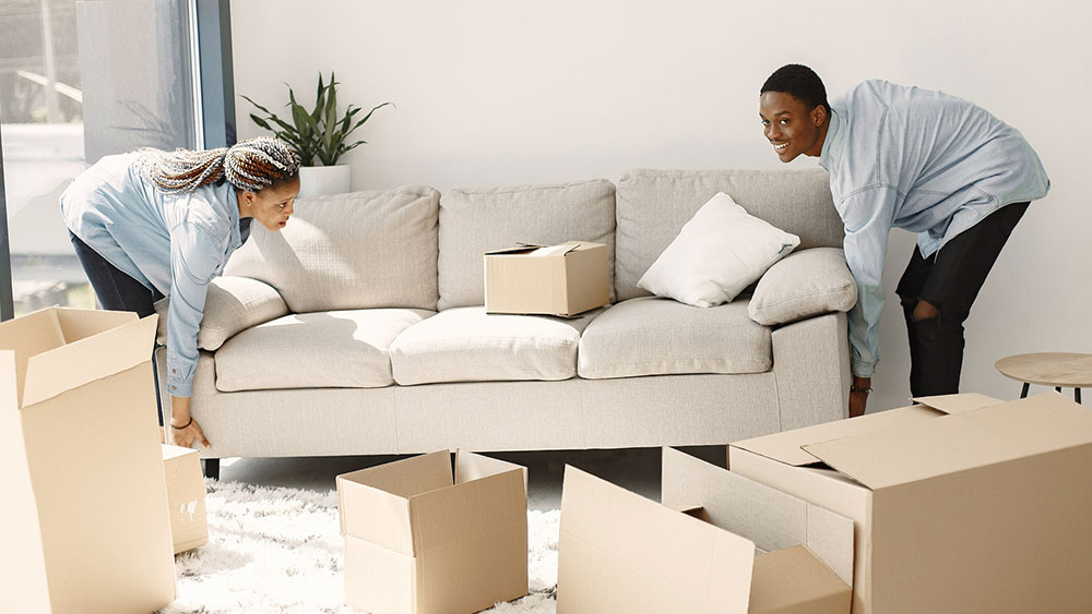 Young couple moving into their new home together.